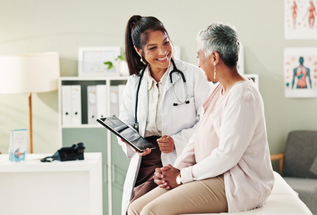 A doctor and patient discussing common reasons why to get a CT scan