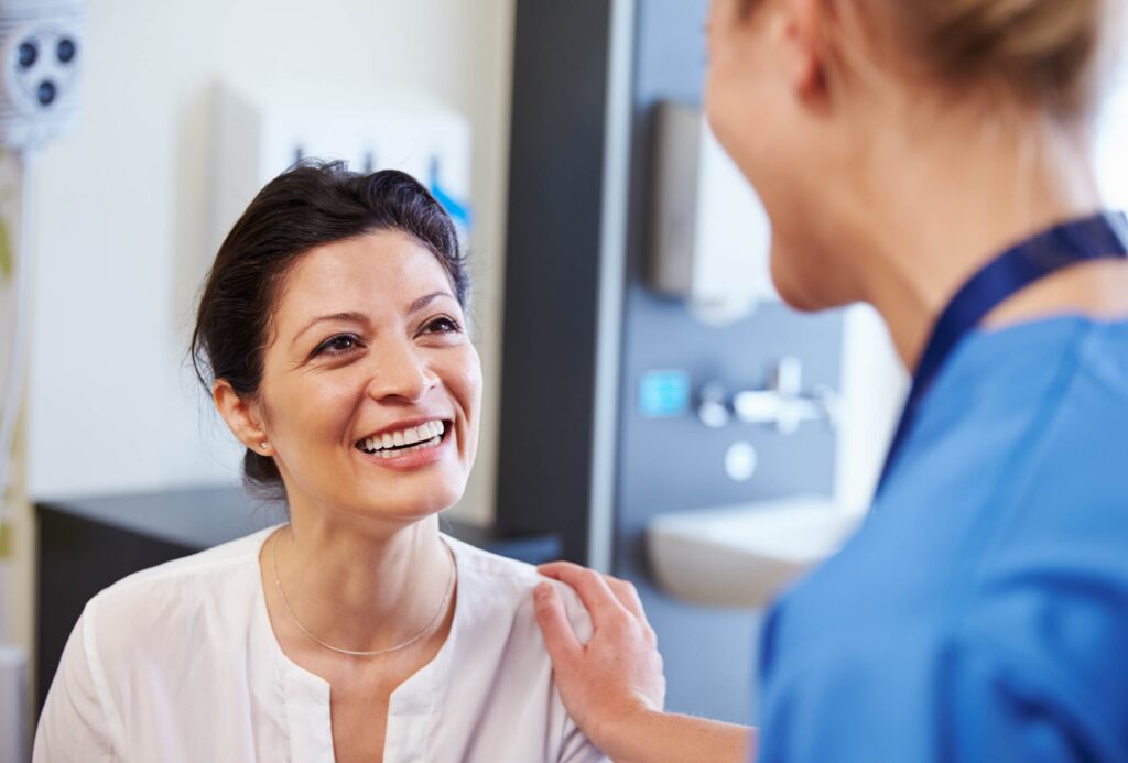 Patient with dental implants talks to her doctor about getting an MRI scan.