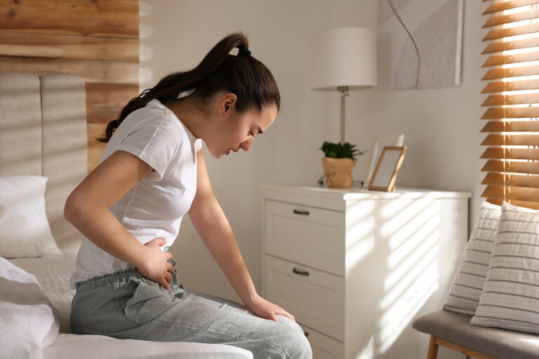 Person struggles with appendicitis.